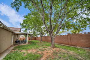 Fenced backyard with a patio area