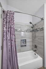 Full bath featuring shower / bath combo