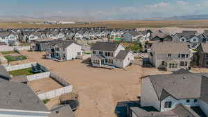 Aerial perspective of suburban area with a mountain backdrop