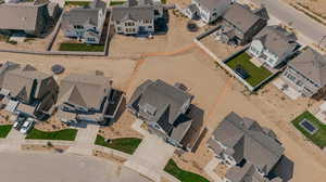 Aerial view of residential area featuring property boundaries highlighted