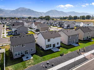 Aerial view of residential area featuring a mountainous background