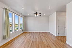 Unfurnished room with light wood finished floors, recessed lighting, and ceiling fan