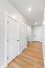 Hall featuring light wood-type flooring and stairway