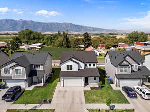 Aerial perspective of suburban area featuring a mountain backdrop