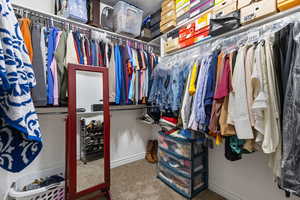 Spacious closet featuring carpet floors