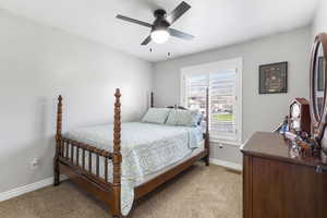 Bedroom with carpet flooring and ceiling fan