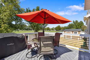 Deck featuring a grill and outdoor dining area