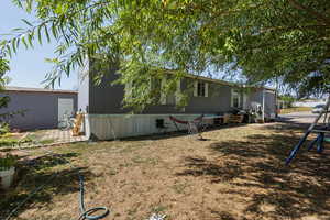 View of side of property with a yard