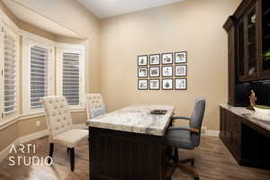 Home office with light wood-type flooring