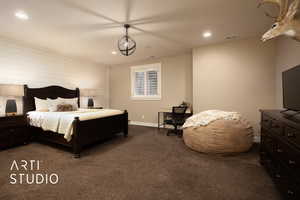 Bedroom featuring dark carpet and recessed lighting