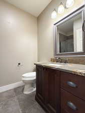 Bathroom with vanity and a stall shower