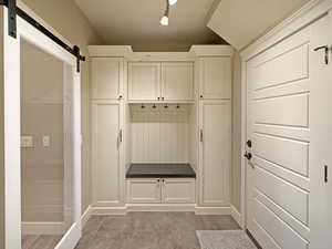 Mudroom with a barn door