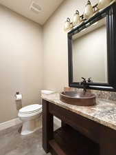 Bathroom with vanity and toilet