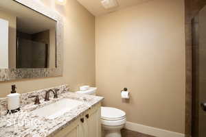 Full bath featuring vanity and a tile shower