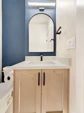 Bathroom featuring vanity and toilet