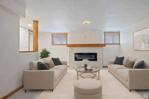 Living room with a premium fireplace and recessed lighting