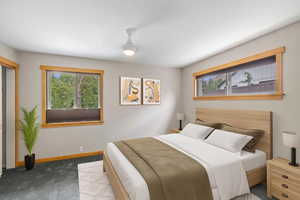 Bedroom with carpet flooring and baseboards