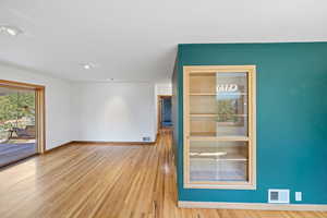 Detailed view of baseboards and wood finished floors