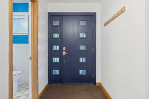 Entrance foyer featuring baseboards