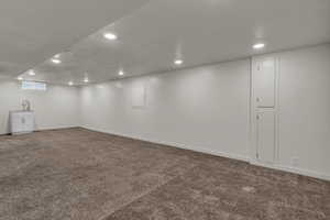 Finished below grade area featuring carpet floors and recessed lighting