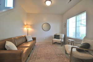 Living room featuring carpet flooring and baseboards