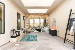 View of pool with a skylight