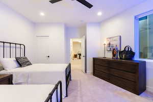 Bedroom featuring light carpet, recessed lighting, and a ceiling fan