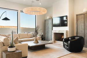 Living area featuring wood finished floors and a high end fireplace