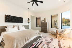 Carpeted bedroom with recessed lighting and a ceiling fan