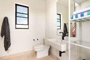 Half bathroom featuring toilet