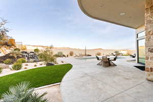 Fenced backyard with a patio area