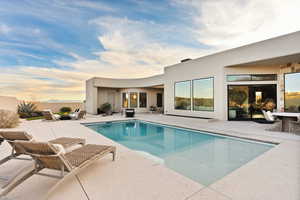 Outdoor pool featuring a patio area