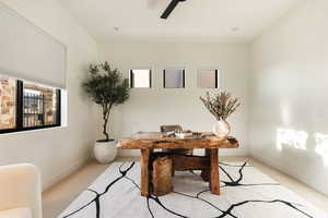 Office area with carpet and a ceiling fan