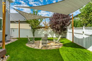 Fenced backyard with a patio area