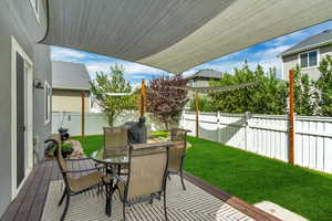 Fenced backyard with outdoor dining area
