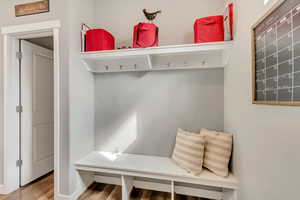 Mudroom with wood finished floors