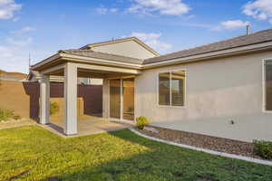 Back of house featuring a patio area and stucco siding