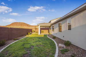 Fenced backyard with a patio area and a mountain view