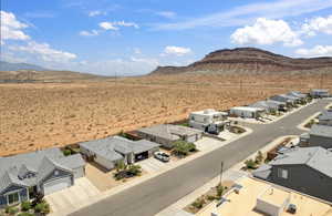 Aerial perspective of suburban area featuring a mountainous background