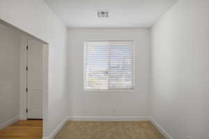 Empty room featuring baseboards