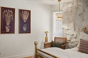 Bedroom featuring baseboards