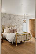 Bedroom with a closet and wood finished floors