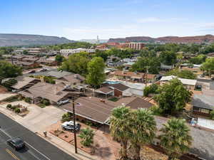 Aerial perspective of suburban area with a mountainous background
