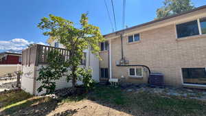 Rear view of house with brick siding