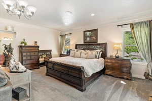 Carpeted bedroom with ornamental molding, a chandelier, recessed lighting, and a textured ceiling