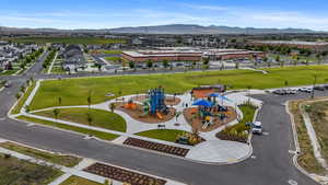 Drone / aerial view of a mountain backdrop and a recreational park