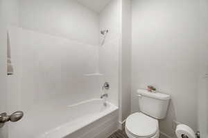Second photo of Full bathroom featuring tub / shower combination and wood finished floors