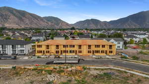View of mountain backdrop featuring nearby suburban area