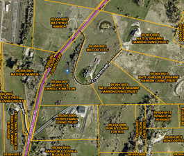 Aerial map of property and surrounding area featuring property parcel outlined