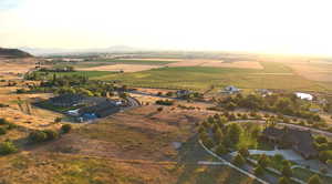Aerial view of property's location featuring rural landscape and a mountain backdrop